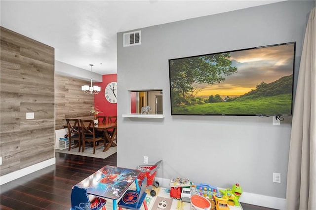 375 Central Ave Unit 196, Riverside, CA 92507 - rec room with wooden walls, wood finished floors, and a chandelier