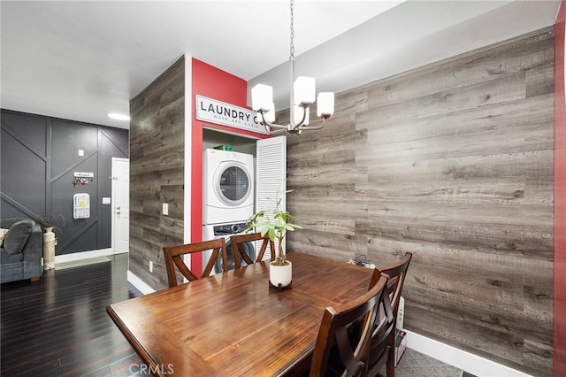 375 Central Ave Unit 196, Riverside, CA 92507 - dining room featuring estacked washer and dryer, a chandelier, wood walls, wood finished floors, and stairs