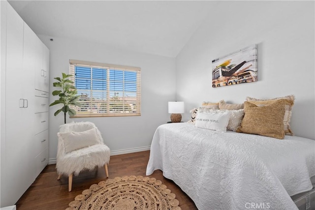 409 Utica Ave Unit C23, Huntington Beach, CA 92648 - bedroom featuring wood finished floors and vaulted ceiling
