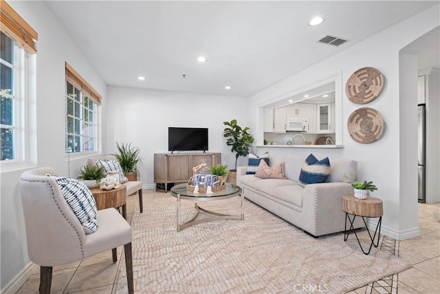 409 Utica Ave Unit C23, Huntington Beach, CA 92648 - living room with recessed lighting and light tile patterned floors