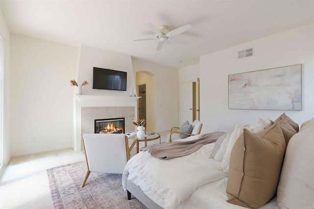837 Calle Lagasca, Chula Vista, CA 91910 - bedroom with a fireplace, arched walkways, light colored carpet, and ceiling fan