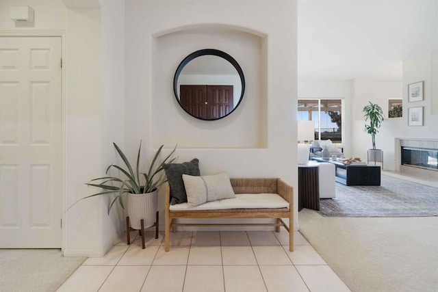 837 Calle Lagasca, Chula Vista, CA 91910 - sitting room featuring carpet floors, a glass covered fireplace, and tile patterned flooring