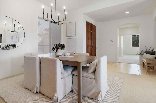 837 Calle Lagasca, Chula Vista, CA 91910 - dining area with a chandelier, light carpet, arched walkways, light tile patterned floors, and recessed lighting