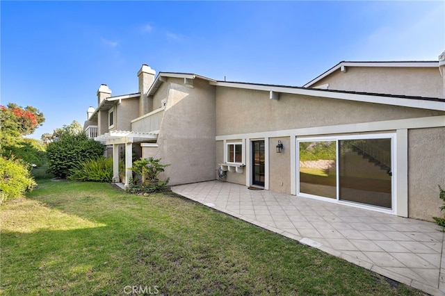 294 Calle Cuervo, San Clemente, CA 92672 - back of house featuring stucco siding, a chimney, a patio, and a lawn