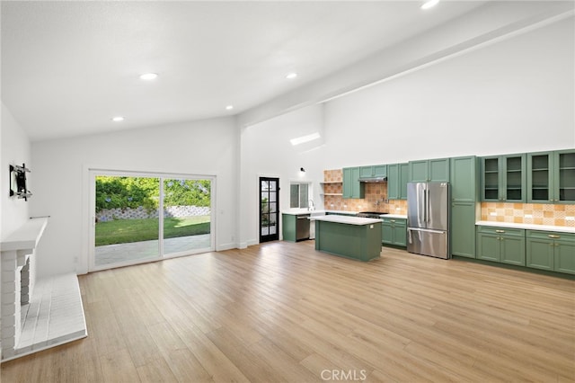 294 Calle Cuervo, San Clemente, CA 92672 - unfurnished living room featuring high vaulted ceiling, recessed lighting, and light wood finished floors