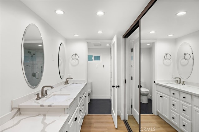 294 Calle Cuervo, San Clemente, CA 92672 - full bath featuring wood finished floors, recessed lighting, double vanity, and an enclosed shower