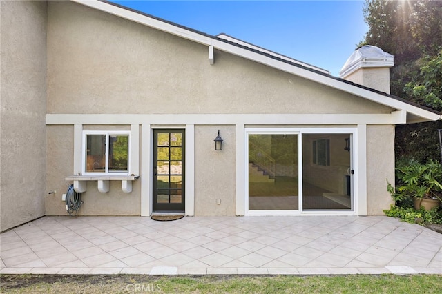 294 Calle Cuervo, San Clemente, CA 92672 - rear view of house featuring a patio, stucco siding, and a chimney