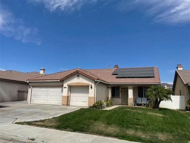 3435 Churchill Ln, Perris, CA 92571 - ranch-style house with a tiled roof, a garage, solar panels, stucco siding, and driveway
