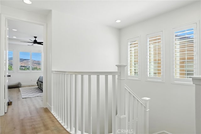12 Rastro St, Rancho Mission Viejo, CA 92694 - corridor featuring light wood-style floors, recessed lighting, and an upstairs landing