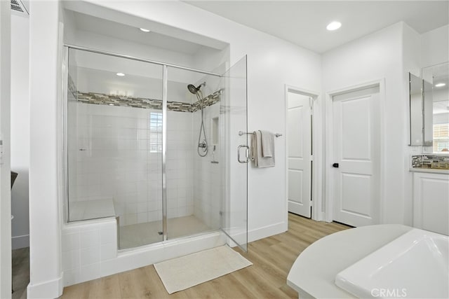 12 Rastro St, Rancho Mission Viejo, CA 92694 - bathroom with a shower stall, wood finished floors, and recessed lighting