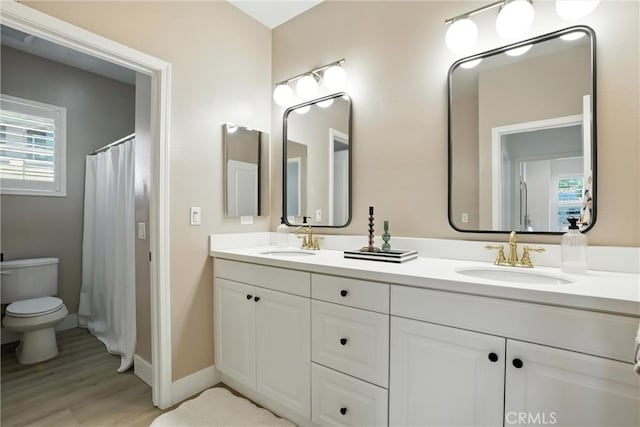 12 Rastro St, Rancho Mission Viejo, CA 92694 - full bathroom with double vanity, wood finished floors, and a shower with curtain