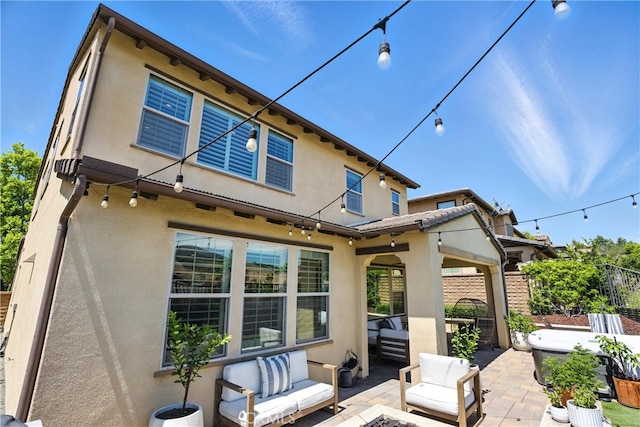 12 Rastro St, Rancho Mission Viejo, CA 92694 - back of house featuring outdoor lounge area, stucco siding, and a patio