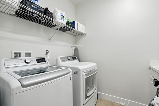 12 Rastro St, Rancho Mission Viejo, CA 92694 - laundry area with separate washer and dryer and light wood finished floors