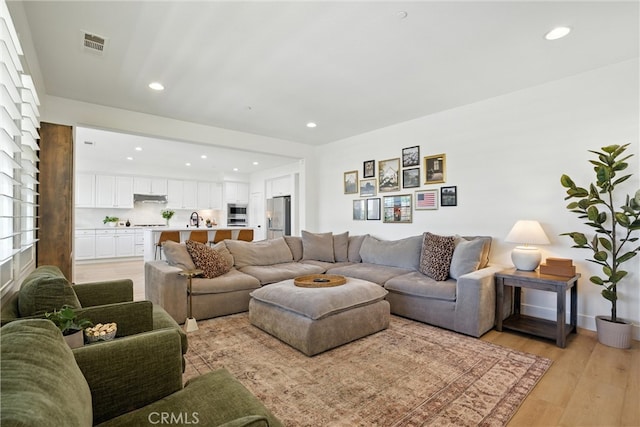 12 Rastro St, Rancho Mission Viejo, CA 92694 - living area with recessed lighting and light wood finished floors