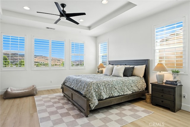 12 Rastro St, Rancho Mission Viejo, CA 92694 - bedroom with a tray ceiling, light wood finished floors, recessed lighting, and ceiling fan