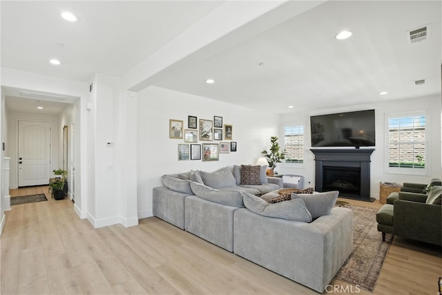 12 Rastro St, Rancho Mission Viejo, CA 92694 - living room featuring light wood-style flooring, recessed lighting, and a fireplace with raised hearth