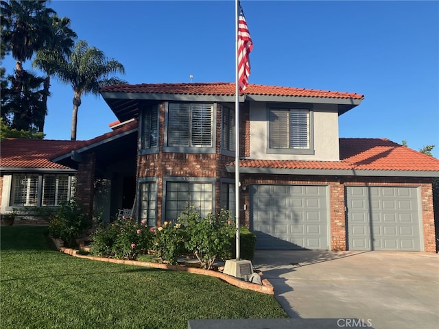 36151 Sharon Way, Yucaipa, CA 92399 - view of front of home featuring a tiled roof, driveway, a front lawn, and brick siding