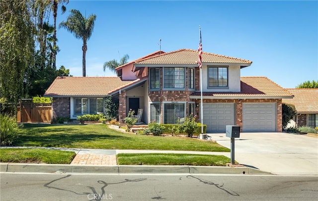 36151 Sharon Way, Yucaipa, CA 92399 - view of front of house with a tile roof, concrete driveway, stucco siding, brick siding, and a garage