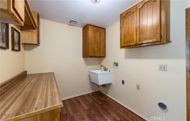 36151 Sharon Way, Yucaipa, CA 92399 - laundry area with dark wood finished floors, hookup for a washing machine, cabinet space, and electric dryer hookup