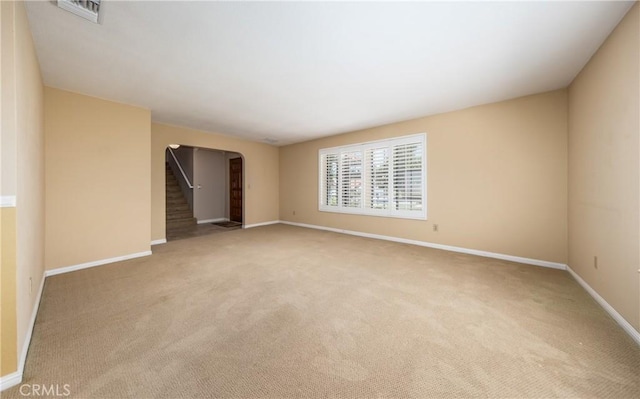 36151 Sharon Way, Yucaipa, CA 92399 - carpeted empty room featuring stairs and arched walkways