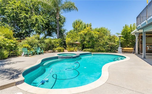 36151 Sharon Way, Yucaipa, CA 92399 - view of swimming pool featuring a patio area, a pool with connected hot tub, and view of scattered trees