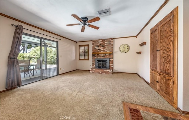 36151 Sharon Way, Yucaipa, CA 92399 - unfurnished living room featuring crown molding, carpet flooring, a ceiling fan, and a brick fireplace