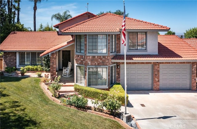 36151 Sharon Way, Yucaipa, CA 92399 - tri-level home featuring brick siding, concrete driveway, a tiled roof, and a front lawn