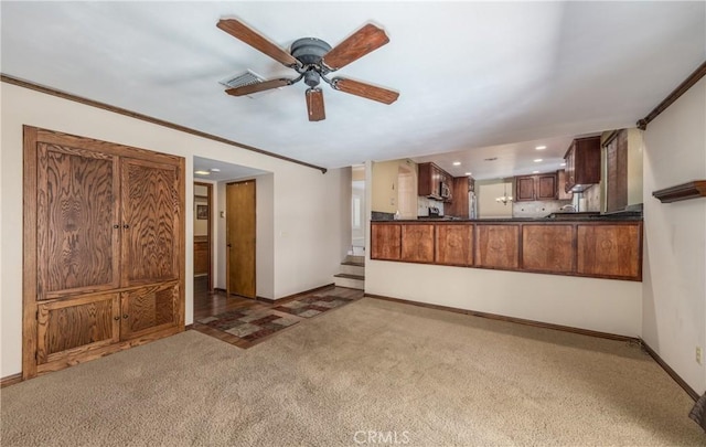 36151 Sharon Way, Yucaipa, CA 92399 - unfurnished living room with carpet floors, ceiling fan, recessed lighting, stairs, and crown molding