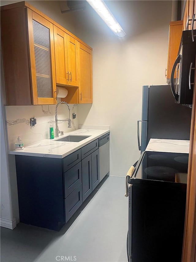 312 W 5th St Unit 1003, Los Angeles, CA 90013 - kitchen featuring appliances with stainless steel finishes and light countertops