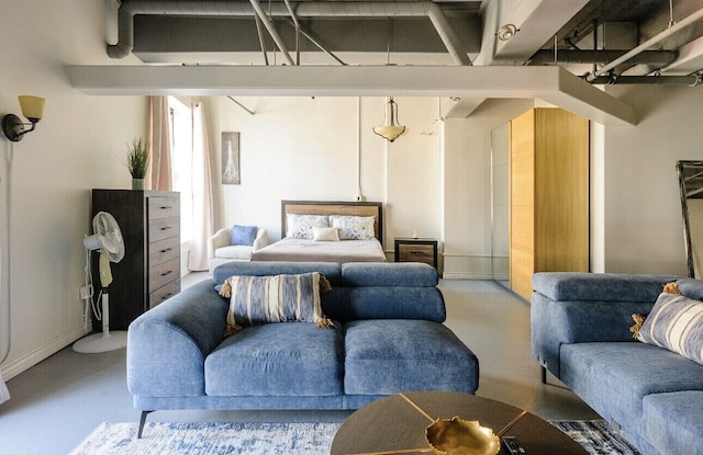 312 W 5th St Unit 1003, Los Angeles, CA 90013 - bedroom with finished concrete flooring and baseboards