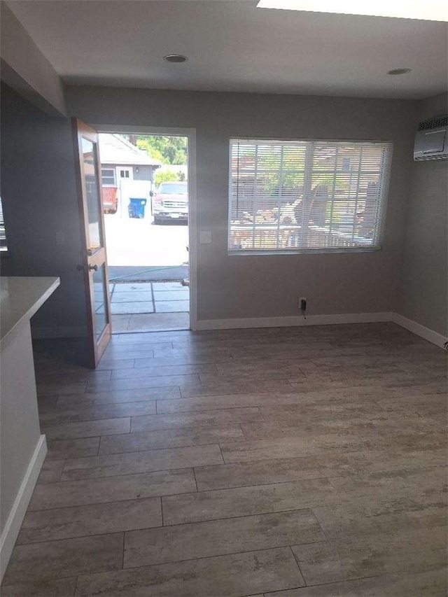 2109 N Marengo Ave, Altadena, CA 91001 - empty room with wood finished floors and an AC wall unit