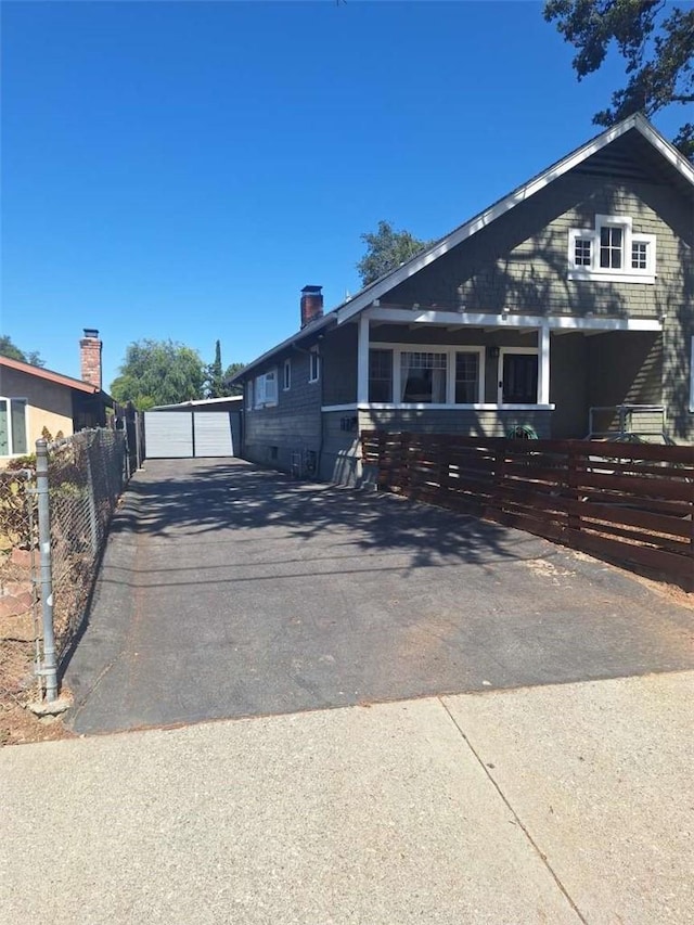 2109 N Marengo Ave, Altadena, CA 91001 - view of front of house featuring a garage and a chimney