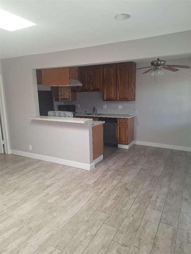 2109 N Marengo Ave, Altadena, CA 91001 - kitchen featuring light wood finished floors, light countertops, fridge, dishwashing machine, and a ceiling fan