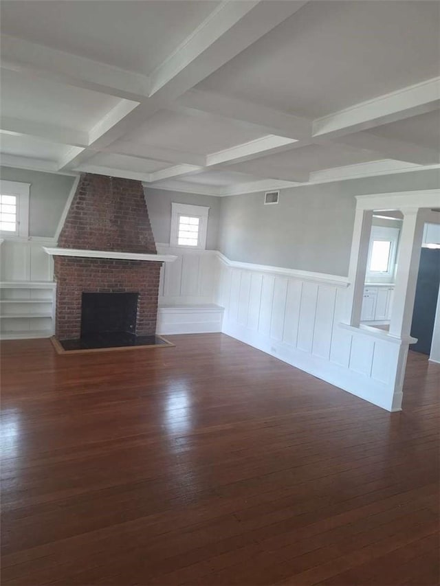 2109 N Marengo Ave, Altadena, CA 91001 - unfurnished living room with coffered ceiling, beamed ceiling, wood finished floors, a decorative wall, and a wainscoted wall