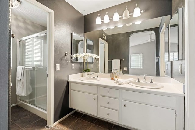 23612 Muir Trl Unit 74, Valencia, CA 91354 - bathroom with a textured wall, a stall shower, plenty of natural light, and tile patterned floors