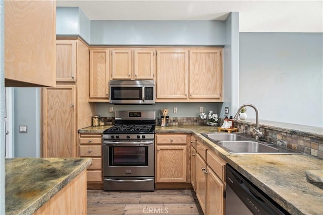 23612 Muir Trl Unit 74, Valencia, CA 91354 - kitchen with stainless steel appliances, light brown cabinets, and light wood-style floors
