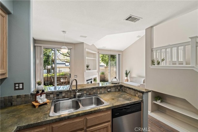 23612 Muir Trl Unit 74, Valencia, CA 91354 - kitchen featuring stainless steel dishwasher, lofted ceiling, decorative light fixtures, and dark wood finished floors