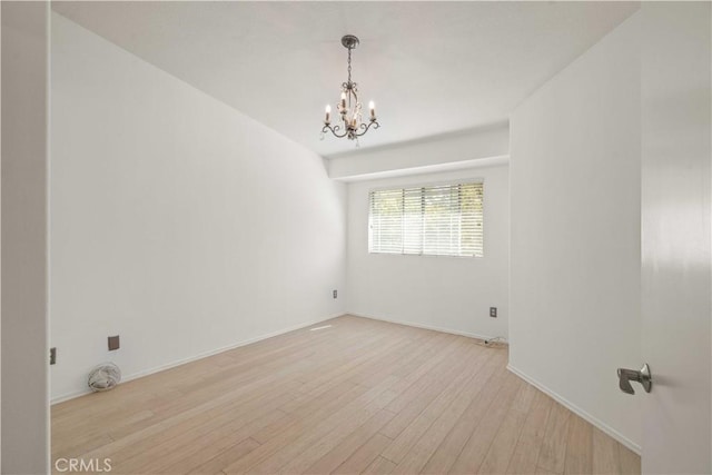 23612 Muir Trl Unit 74, Valencia, CA 91354 - spare room with a chandelier and light wood-type flooring
