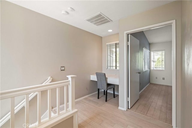 23612 Muir Trl Unit 74, Valencia, CA 91354 - hallway with light wood-style flooring and baseboards