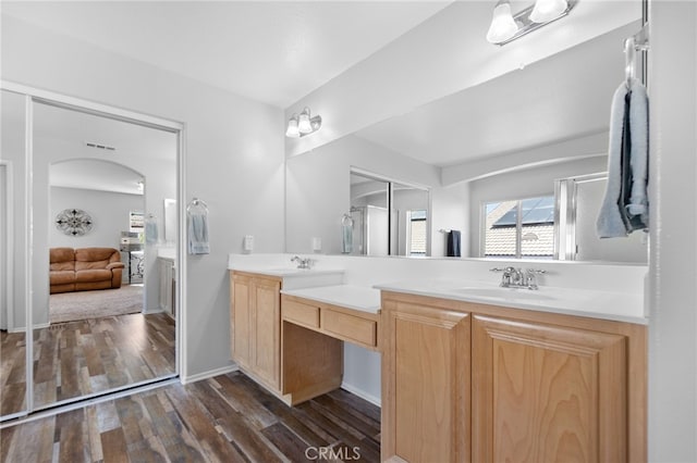 29063 Boulder Crest Way, Menifee, CA 92584 - bathroom featuring double vanity, wood finished floors, and ensuite bath