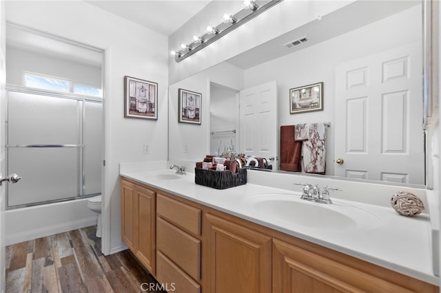 29063 Boulder Crest Way, Menifee, CA 92584 - full bath featuring double vanity, wood finished floors, and combined bath / shower with glass door