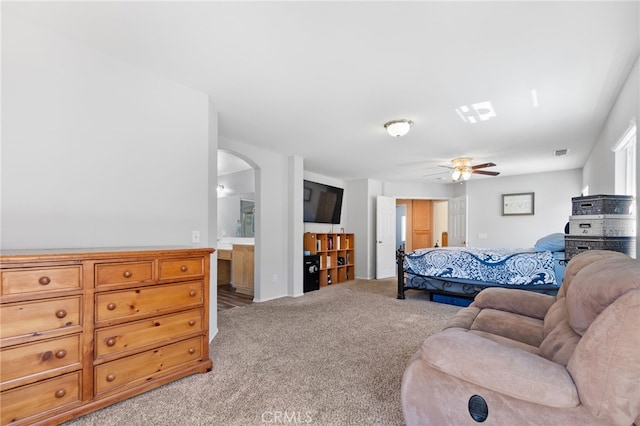 29063 Boulder Crest Way, Menifee, CA 92584 - bedroom featuring light carpet, arched walkways, and ensuite bathroom