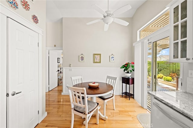 23974 Via Astuto, Murrieta, CA 92562 - dining area with light wood-style floors, wainscoting, and ceiling fan