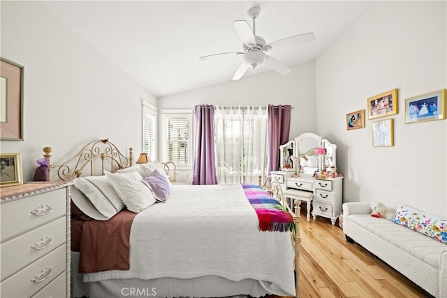 23974 Via Astuto, Murrieta, CA 92562 - bedroom with vaulted ceiling, light wood-style flooring, and a ceiling fan