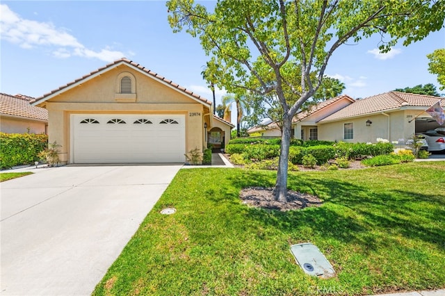 23974 Via Astuto, Murrieta, CA 92562 - view of front of home with stucco siding, a tile roof, a front lawn, and concrete driveway