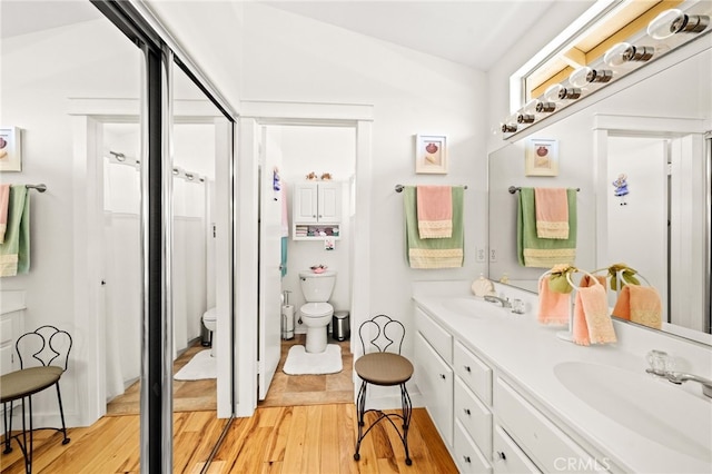 23974 Via Astuto, Murrieta, CA 92562 - bathroom featuring wood finished floors and double vanity