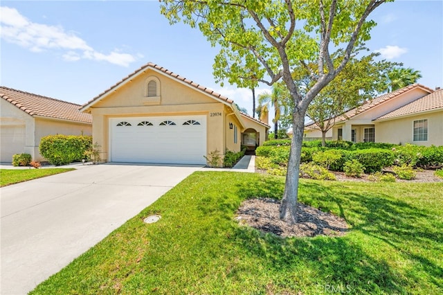 23974 Via Astuto, Murrieta, CA 92562 - view of front facade with concrete driveway, a front lawn, stucco siding, and a garage
