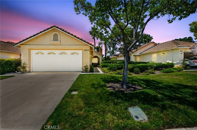 23974 Via Astuto, Murrieta, CA 92562 - view of front of house with stucco siding, a tile roof, driveway, and a lawn