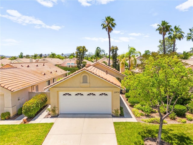 23974 Via Astuto, Murrieta, CA 92562 - view of front of property with stucco siding, driveway, a tile roof, a garage, and a residential view