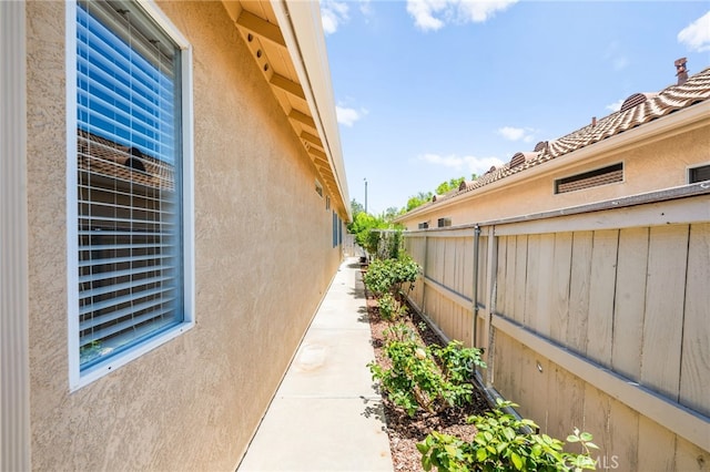 23974 Via Astuto, Murrieta, CA 92562 - view of side of home with stucco siding